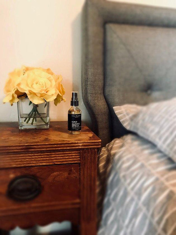 Tiny Human Supply Co Sanity Spray™ Refreshing Facial Mist on bedside table