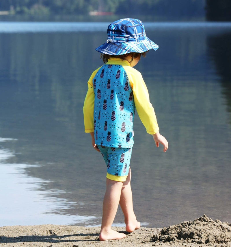 shirt and shorts set displayed on a little boy at the lake